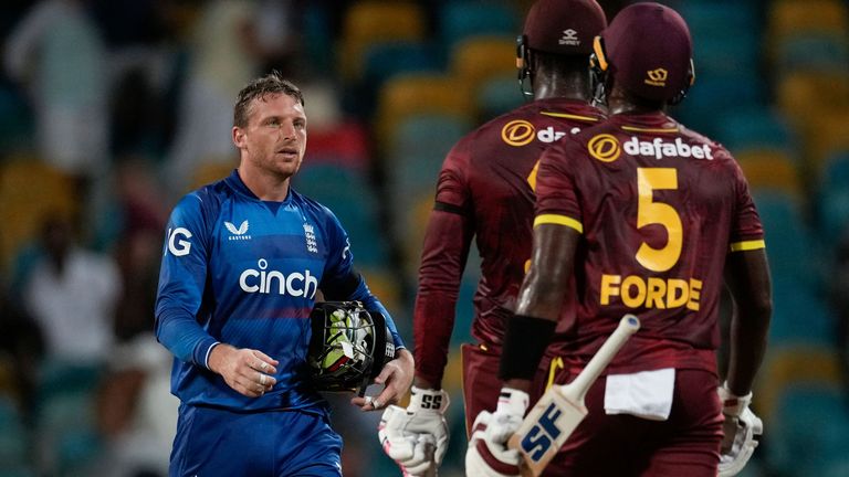 England&#39;s captain Jos Buttler walks off the field after losing the three-match series 2-1 against the West Indies