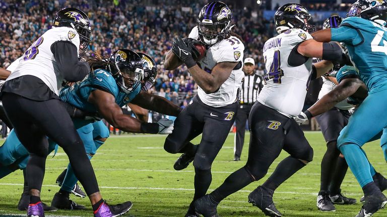 Gus Edwards scores a touchdown for the Ravens en route to victory at Jacksonville