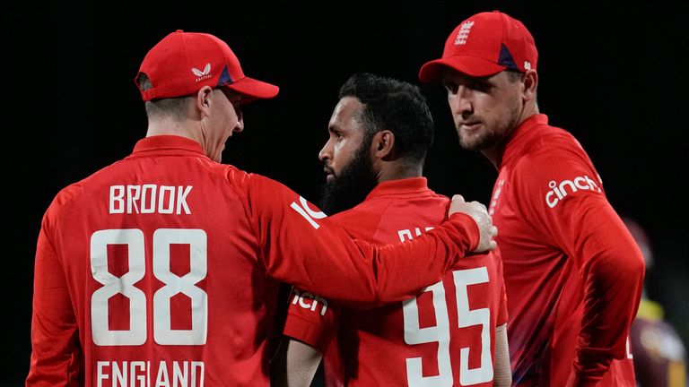 England&#39;s Harry Brook embracers bowler Adil Rashid after taking the catch to dismiss West Indies&#39; Kyle Mayers