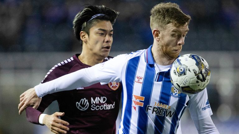 KILMARNOCK, SCOTLAND - DECEMBER 02: Kilmarnock&#39;s Stuart Findlay and Hearts&#39; Yutaro Oda in action during a cinch Premiership match between Kilmarnock and Heart of Midlothian at Rugby Park, on December 02, 2023, in Kilmarnock, Scotland. (Photo by Alan Harvey / SNS Group)