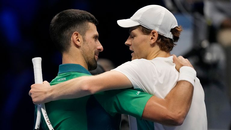 Italy&#39;s Jannik Sinner, right, embraces Serbia&#39;s Novak Djokovic at the end of the match