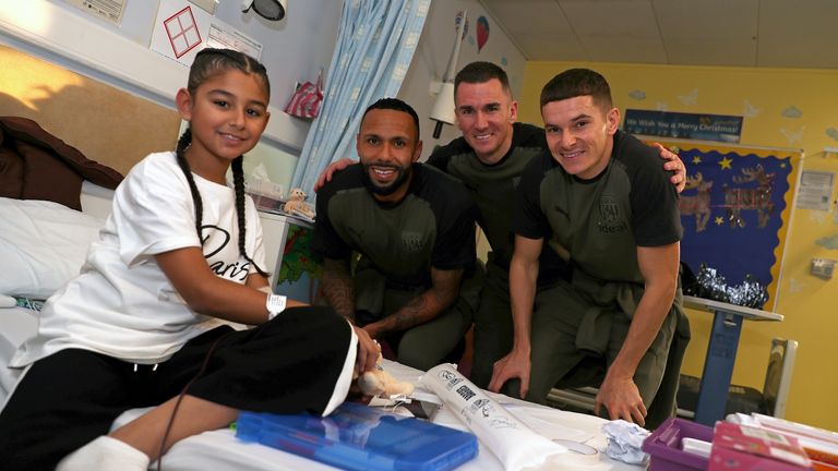 WEST BROMWICH, ENGLAND - DECEMBER 15: Kyle Bartley of West Bromwich Albion, Jed Wallace of West Bromwich Albion and Conor Townsend  of West Bromwich Albion during a visit to Sandwell Hospital Children&#39;s Ward on December 15, 2023 in West Bromwich, England. (Photo by Adam Fradgley/West Bromwich Albion FC via Getty Images)