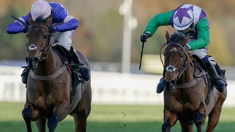 Jonathan Burke riding Beat The Bat (R, green sleeves) clear the last to win The Ascot Partners &#39;National Hunt&#39; Maiden Hurdle at Ascot ahead of Welcom To Cartries (left)