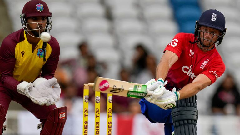 England&#39;s captain Jos Buttlerp lays a shot against West Indies during the fourth T20 cricket match at Brian Lara Stadium in Tarouba, Trinidad and Tobago, Tuesday, Dec. 19, 2023. (AP Photo/Ricardo Mazalan)