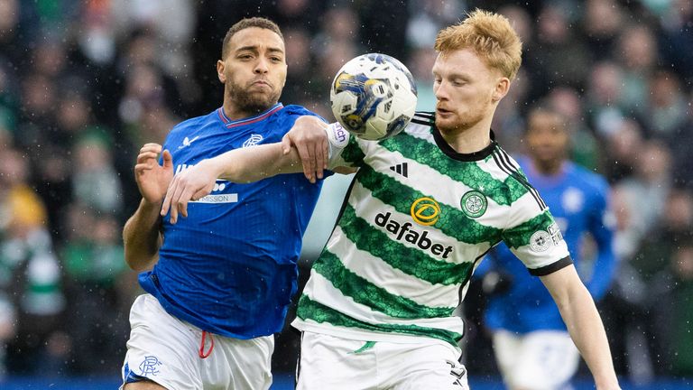 Celtic&#39;s Liam Scales and Rangers&#39; Cyriel Dessers battle for the ball