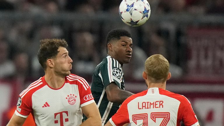 Manchester United&#39;s Marcus Rashford, centre, is challenged by Bayern&#39;s Leon Goretzka, left, and Konrad Laimer during the Champions League group A soccer match between Bayern Munich and Manchester United at the Allianz Arena stadium in Munich, Germany, Wednesday, Sept. 20, 2023. (AP Photo/Matthias Schrader)