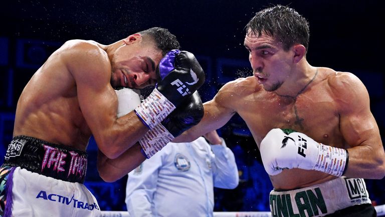 Michael Conlan punches Jordan Gill during the WBA International Super Featherweight Title fight