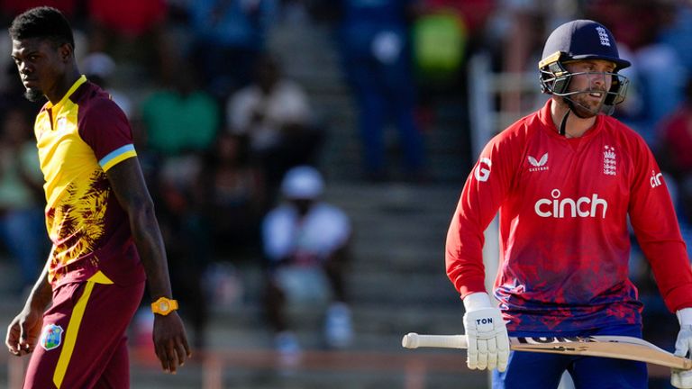 England&#39;s Phil Salt..walks off the field after his dismissal as West Indies&#39; bowler Alzarri Joseph looks on during the second T20 cricket match at National Cricket Stadium in Saint George&#39;s, Grenada, Thursday, Dec. 14, 2023. (AP Photo/Ricardo Mazalan)