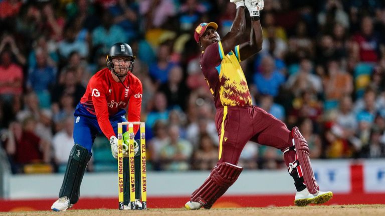 West Indies&#39; Roman Powell hits a six against England during the first T20 cricket match at Kensington Oval in Bridgetown, Barbados, Tuesday, Dec. 12, 2023. (AP Photo/Ricardo Mazalan)