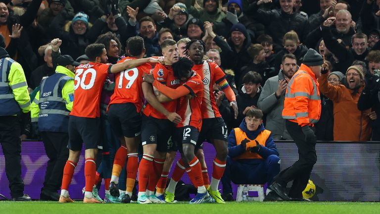 Luton Town&#39;s Ross Barkley celebrates with team-mates after scoring his side&#39;s third goal (AP)