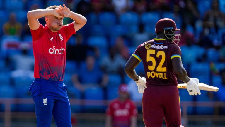 England&#39;s Sam Curran..reacts as West Indies&#39; captain Rovman Powell scores runs from his bowling during the third T20 cricket match at National Cricket Stadium in Saint George&#39;s, Grenada, Saturday, Dec. 16, 2023. (AP Photo/Ricardo Mazalan)