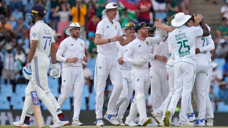 South Africa&#39;s Nandre Burger celebrates with teammates after dismissing India&#39;s batsman Yashasvi Jaiswal for five