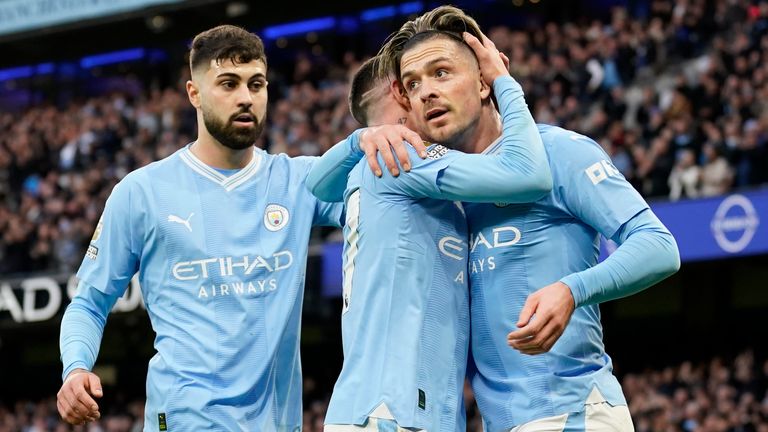 Manchester City&#39;s Jack Grealish celebrates with Phil Foden after scoring