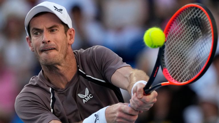 Andy Murray of Britain plays a backhand return to Tomas Martin Etcheverry of Argentina during their first round match at the Australian Open tennis championships at Melbourne Park, Melbourne, Australia, Monday, Jan. 15, 2024. (AP Photo/Andy Wong)