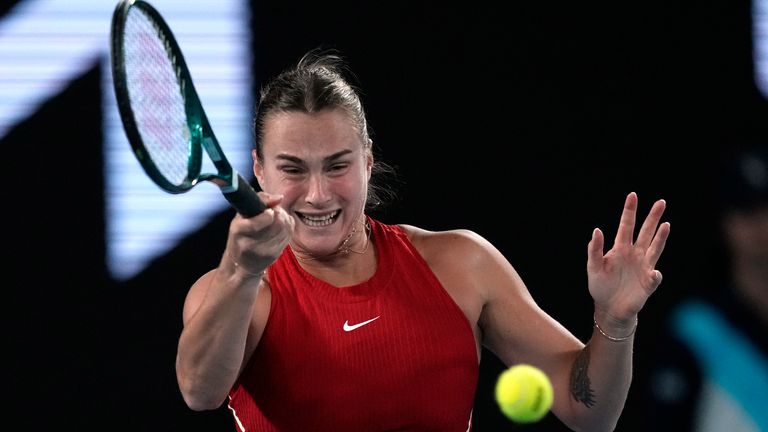 Aryna Sabalenka of Belarus plays a forehand return to Barbora Krejcikova of the Czech Republic during their quarterfinal match at the Australian Open tennis championships at Melbourne Park, Melbourne, Australia, Tuesday, Jan. 23, 2024. (AP Photo/Louise Delmotte)