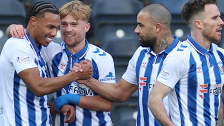 KILMARNOCK, SCOTLAND - JANUARY 27: Kilmarnock's Corrie Nbada celebrates with teammates after Hibernian's Dylan Vente scores an own goal to make it 1-0 during a cinch Premiership match between Kilmarnock and Hibernian at Rugby Park, on January 27, 2024, in Kilmarnock, Scotland. (Photo by Roddy Scott / SNS Group)