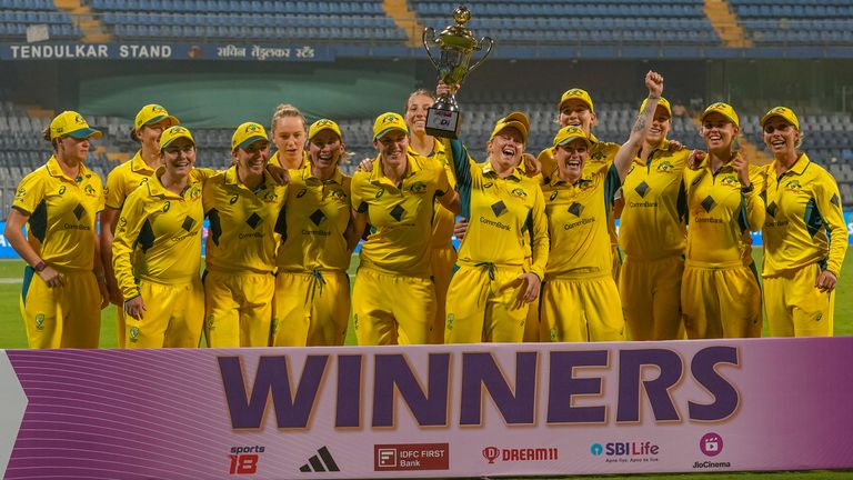 Australia celebrate with their trophy after beating India 3-0 in their ODI series in Mumbai