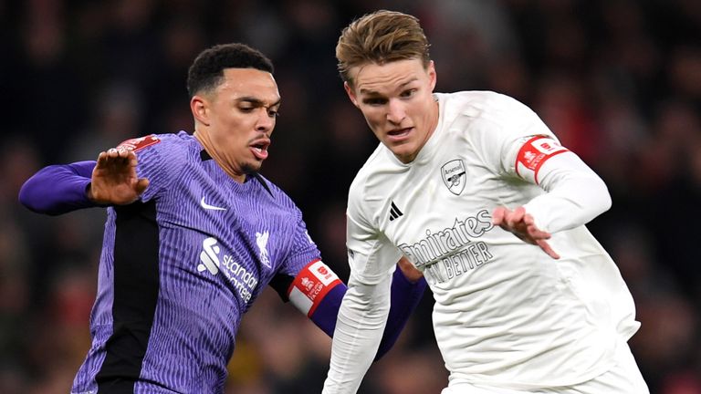 Martin Odegaard rides a challenge from Trent Alexander-Arnold