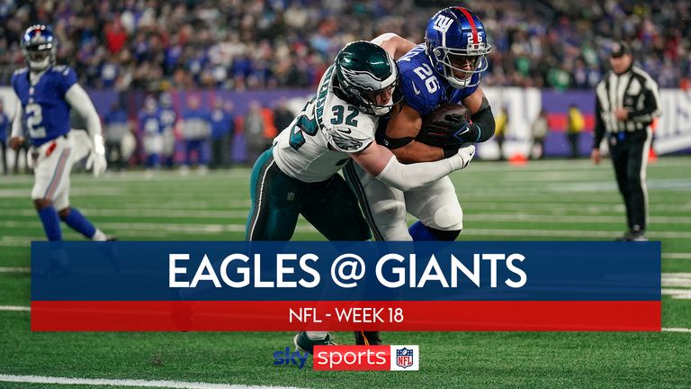 New York Giants running back Saquon Barkley carries the ball into the end zone for a touchdown against Philadelphia Eagles safety Reed Blankenship