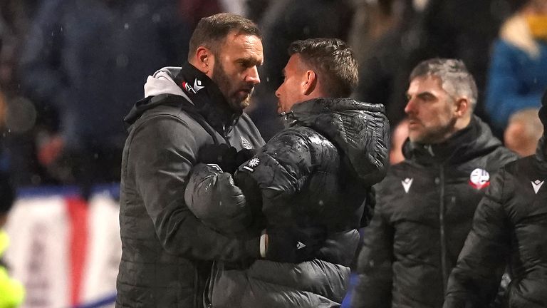 Ian Evatt and Rob Edwards embrace at the final whistle