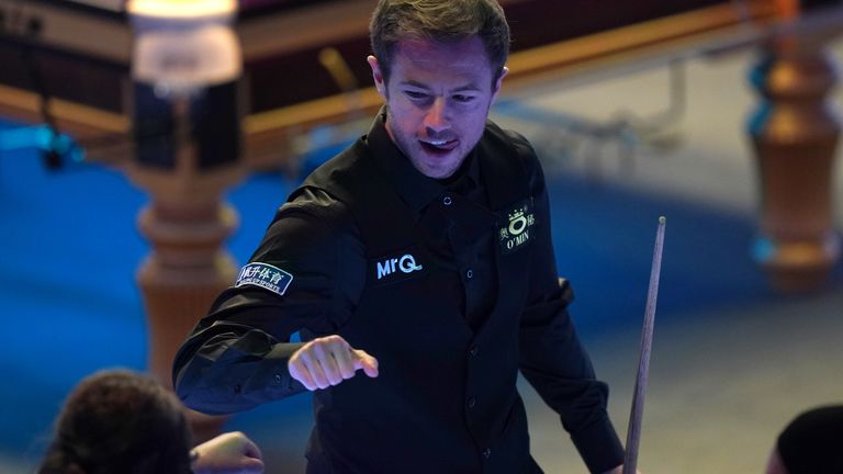 Jack Lisowski celebrates his win as he booked a quarter-final place at Ally Pally