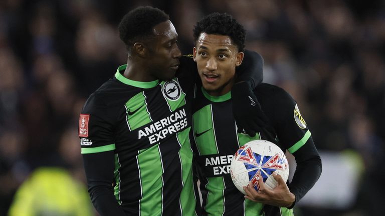 Joao Pedro celebrates with Danny Welbeck and the matchball after scoring a hat-trick in the 5-2 win over Sheffield United