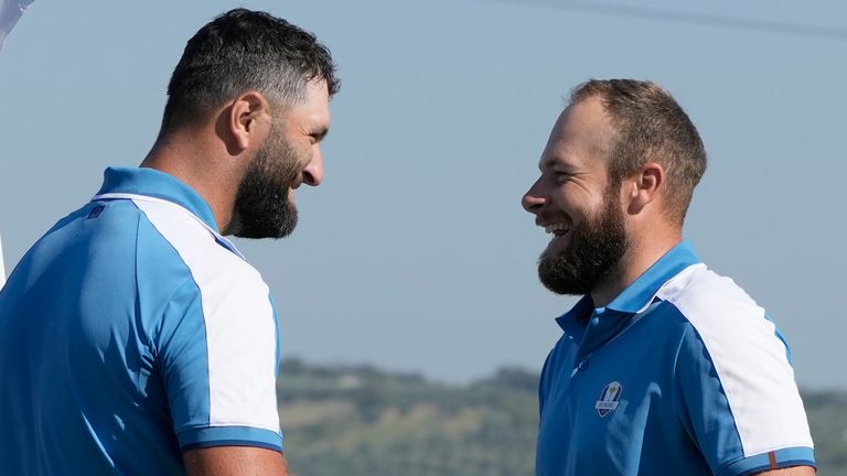 Europe's Jon Rahm, left and playing partner Europe's Tyrrell Hatton celebrate on the 15th green after winning their morning Foursome match 4&3 at the Ryder Cup golf tournament at the Marco Simone Golf Club in Guidonia Montecelio, Italy, Friday, Sept. 29, 2023. (AP Photo/Alessandra Tarantino)