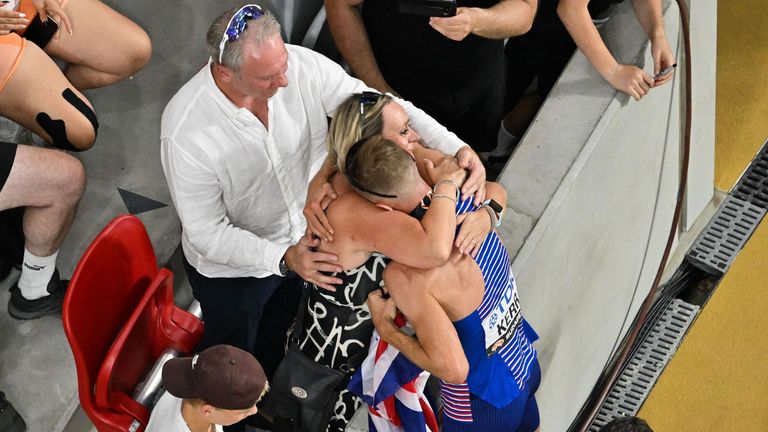 Kerr with his parents in the stadium in Budapest celebrating his gold medal in the 1500m