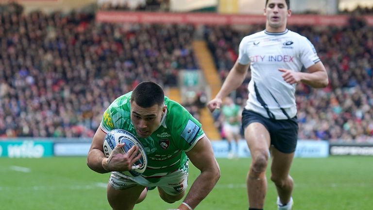 Leicester Tigers' Dan Kelly dives in to score the first try against Saracens 