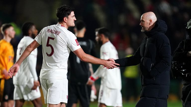 Erik ten Hag shakes hands with Harry Maguire