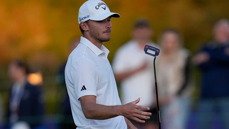 Nicolai Hojgaard tosses his putter after missing his putt for birdie on the 18th hole of the Sorth Course at Torrey Pines during the third round of the Farmers Insurance Open golf tournament, Friday, Jan. 26, 2024, in San Diego. (AP Photo/Gregory Bull)