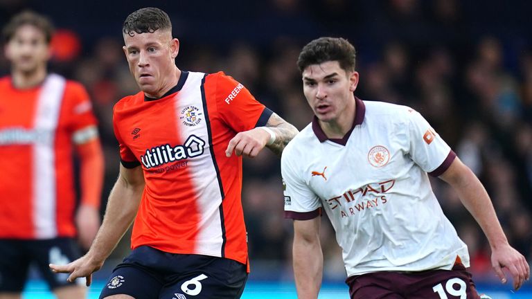 Ross Barkley plays a pass under pressure from Julian Alvarez 