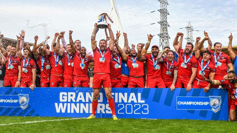 Picture by Olly Hassell/SWpix.com - 15/10/2023 - Rugby League - Betfred Championship Grand Final - Toulouse Olympique v London Broncos - Stade Ernest-Wallon, Toulouse, France - London Broncos lift the Championship Trophy after their victory over Toulouse Olympique promoting them to the Super League