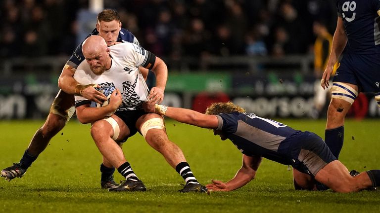 Bristol Bears' Josh Caulfield is tackled by Sale Sharks' Ross Harrison