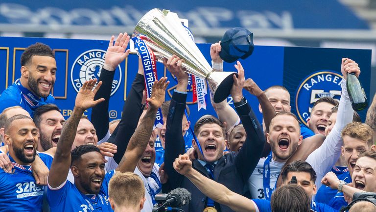 GLASGOW, SCOTLAND - MAY 15: Rangers manager Steven Gerrard lifts the Premiership trophy during the Scottish Premiership match  between Rangers and Aberdeen  at Ibrox Stadium, on May 15, 2021, in Glasgow, Scotland. (Photo by Craig Williamson / SNS Group)