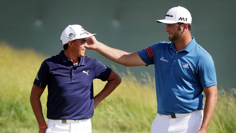 Rickie Fowler of the United State (L) and Jon Rahm of Spain meet on the tenth green during the second round of the 2017 U.S. Open at Erin Hills on June 16, 2017 in Hartford, Wisconsin. (Photo by Streeter Lecka/Getty Images)