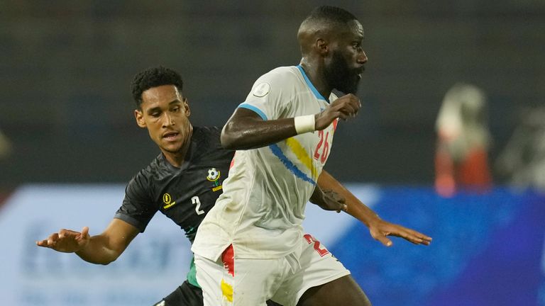 Tanzania's Haji Mnoga, left, challenges for the ball with DR Congo's Arthur Masuaku during the African Cup of Nations Group F soccer match between Tanzania and DR Congo at the Amadou Gon Coulibaly Stadium in Korhogo, Ivory Coast, Wednesday, Jan. 24, 2024. (AP Photo/Themba Hadebe)