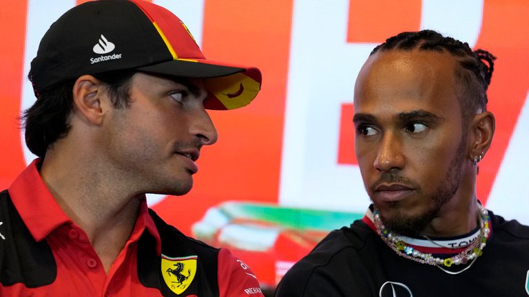 Ferrari driver Carlos Sainz of Spain, left, talks to Mercedes driver Lewis Hamilton of Britain during a press conference at the Baku circuit, in Baku, Azerbaijan, Thursday, April 27, 2022. The Formula One Grand Prix will be held on Sunday April 30, 2023. (AP Photo/Sergei Grits)