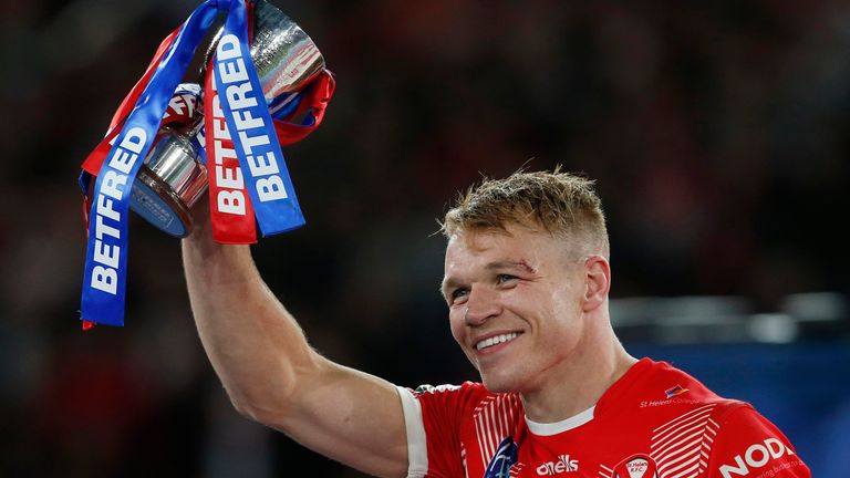 Picture by Ed Sykes/SWpix.com - 24/09/2022 - Rugby League - Betfred Super League Grand Final - St Helens v Leeds Rhinos - Old Trafford, Manchester, England - St Helens' Jonny Lomax celebrates with the Harry Sunderland Man of the Match Trophy 