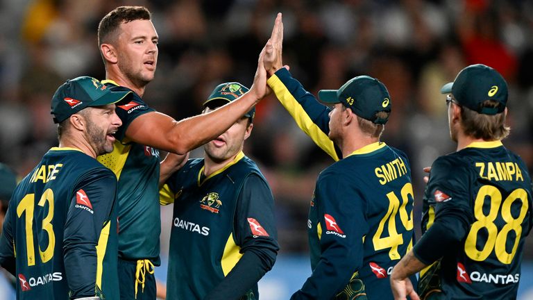 Australia's Josh Hazlewood celebrates with teammates after taking the wicket of New Zealand's Finn Allen during the T20 cricket international between Australia and New Zealand at Eden Park in Auckland, New Zealand, Friday, Feb. 23, 2024. (Andrew Cornaga/Photosport via AP)