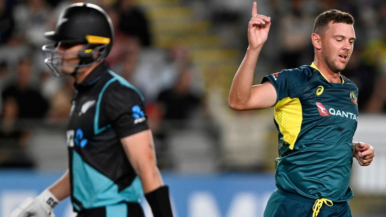 Australia's Josh Hazlewood celebrates after taking the wicket of New Zealand's Finn Allen, left, during the T20 cricket international between Australia and New Zealand at Eden Park in Auckland, New Zealand, Friday, Feb. 23, 2024. (Andrew Cornaga/Photosport via AP)