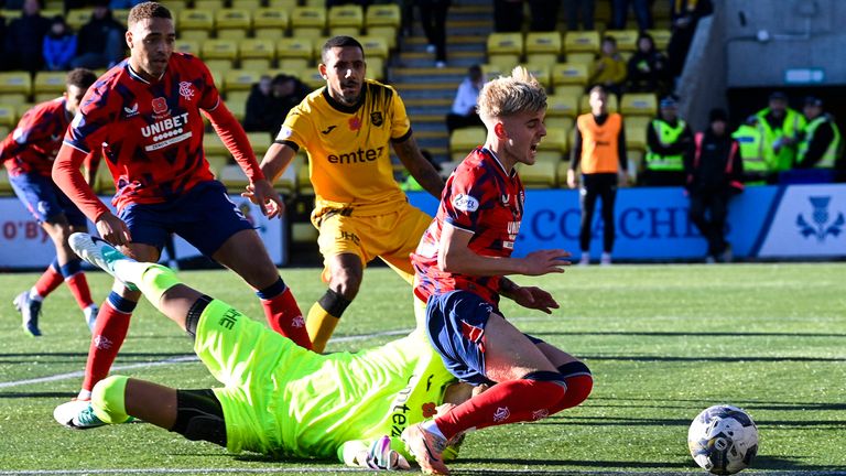 LIVINGSTON, SCOTLAND - NOVEMBER 12: Rangers&#39; Ross McCausland goes down in the box and wins a penalty after making contact with Livingston&#39;s Shamal George during a cinch Premiership match between Livingston and Rangers at the Tony Macaroni Arena, on November 12, 2023, in Livingston, Scotland. (Photo by Rob Casey / SNS Group)