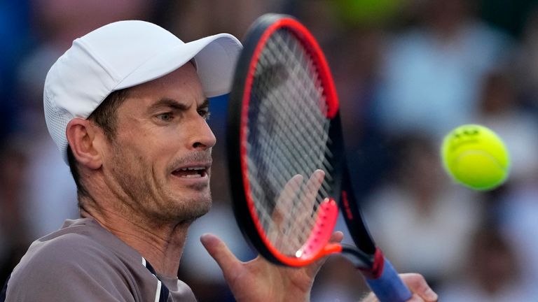 Andy Murray of Britain plays a forehand return to Tomas Martin Etcheverry of Argentina during their first round match at the Australian Open tennis championships at Melbourne Park, Melbourne, Australia, Monday, Jan. 15, 2024. (AP Photo/Andy Wong)