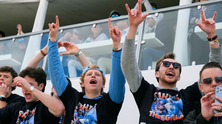 Supporters of golfer Sahith Theegala cheer him on at the 16th hole during the continuation of the second round of the Phoenix Open golf tournament, Saturday, Feb. 10, 2024, in Scottsdale, Ariz. (AP Photo/Ross D. Franklin)