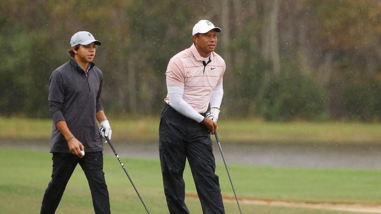 ORLANDO, FLORIDA - DECEMBER 16: Tiger Woods of the United States and son Charlie Woods look on from the 14th hole during the first round of the PNC Championship at The Ritz-Carlton Golf Club on December 16, 2023 in Orlando, Florida. (Photo by Mike Mulholland/Getty Images)