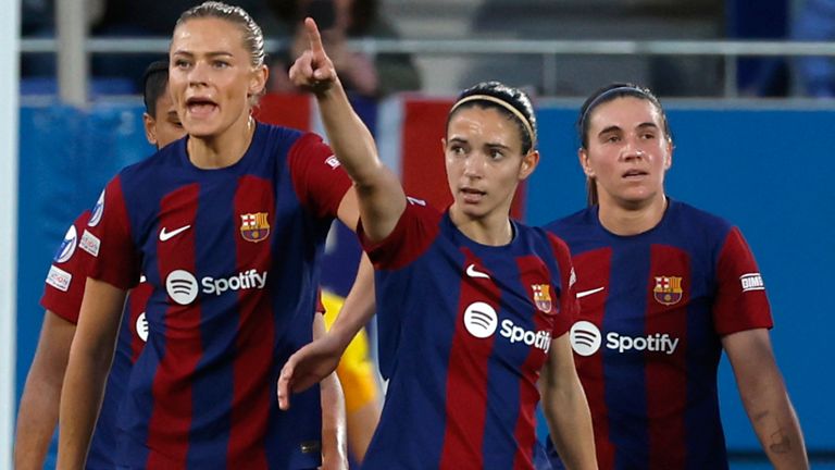 Barcelona's Aitana Bonmati, centre, celebrates after scoring her side's opening goal during the women's Champions League quarterfinals, second leg, soccer match between FC Barcelona and SK Brann Kvinner at the Estadi Johan Cruyff in Barcelona, Spain, Thursday, March 28, 2024. (AP Photo/Joan Monfort)