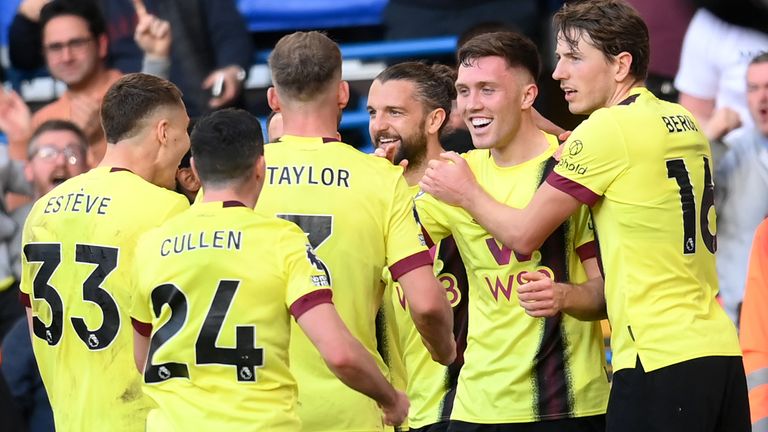 Dara O'Shea is mobbed after scoring a late equaliser for Burnley at Chelsea