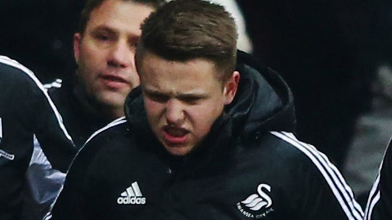 SWANSEA, WALES - JANUARY 23:  A ball boy (2R) walks off of the pitch after being kicked by Eden Hazard of Chelsea who is sent off during the Capital One Cup Semi-Final Second Leg match between Swansea City and Chelsea at Liberty Stadium on January 23, 2013 in Swansea, Wales.  (Photo by Michael Steele/Getty Images)