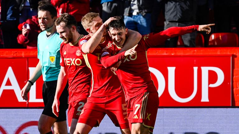 Aberdeen's Jamie McGrath celebrates his winner with Richard Jensen 