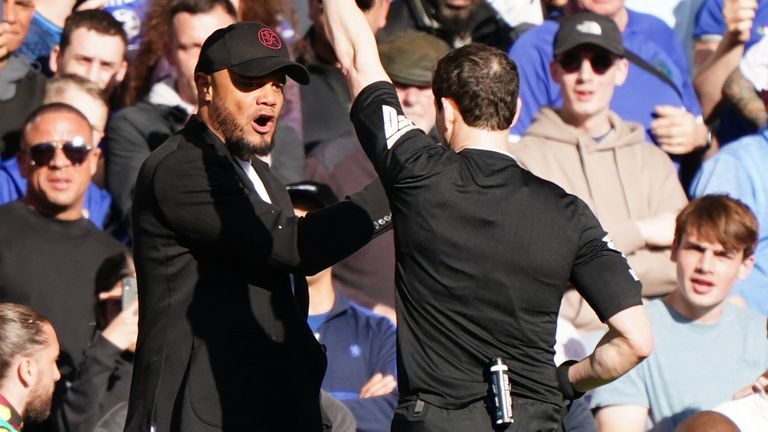 Vincent Kompany is shown a red card by referee Darren England